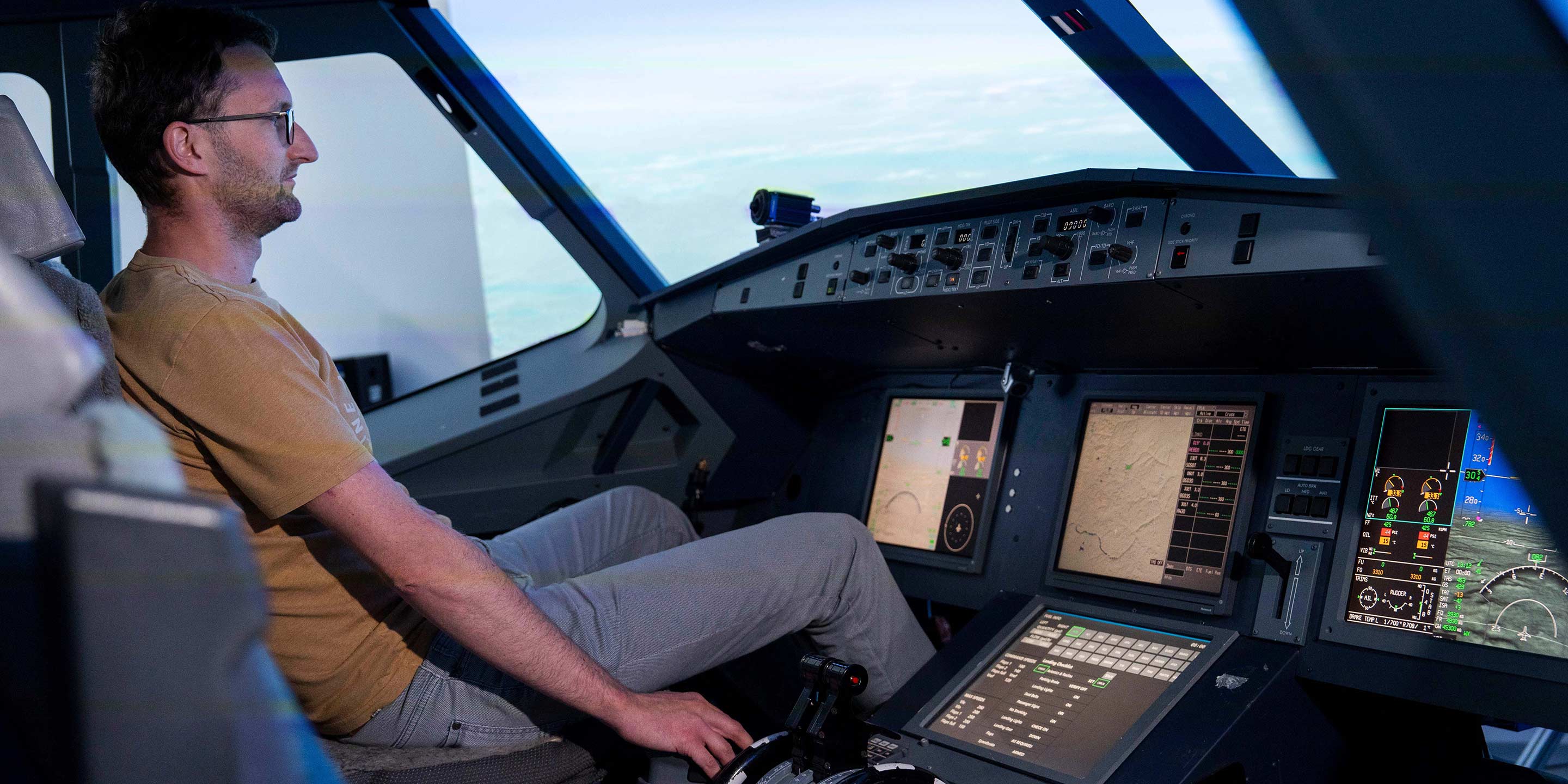 Pilot Drowsiness Technology Honeywell an image of a man seated in a plane cockpit with Honeywell technology monitoring for pilot drowsiness